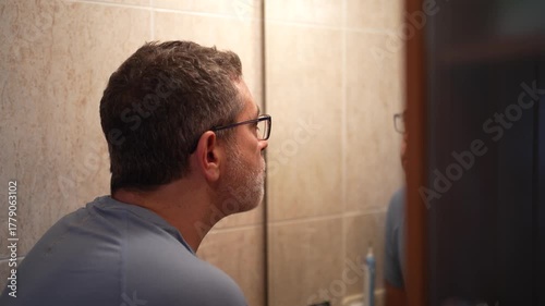 The Essential Man Grooming Routine Shaving in the Bathroom for a Clean and Polished Look