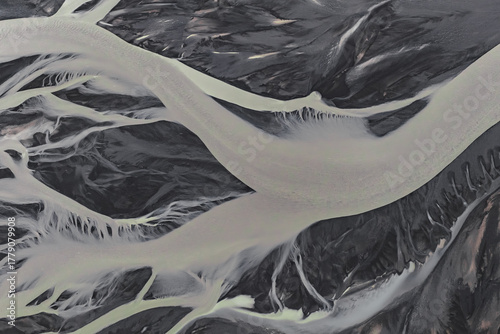 фотографія Aerial view of braided glacial rivers on dark volcanic sand in Iceland