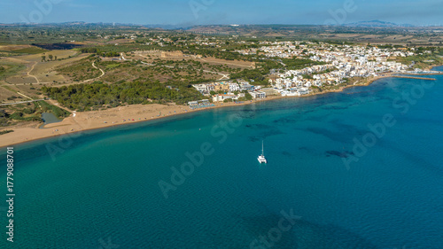 Aerial view of the beach and town of Selinunte, a hamlet of Castelvetrano, located in the province of Trapani, Sicily, Italy. In background is the archaeological park of the ancient Greek acropolis.