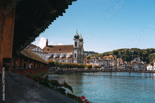 Tableau sur toile Lucerne chapel bridge and jesuit church beside reuss river in switzerland