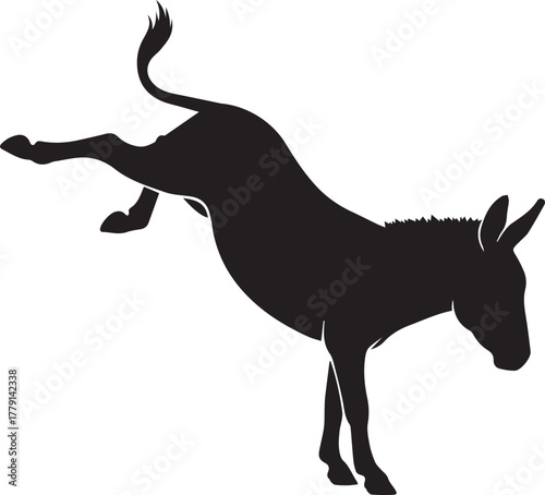 Dynamic black silhouette of a donkey kicking up its heels playfully outdoors