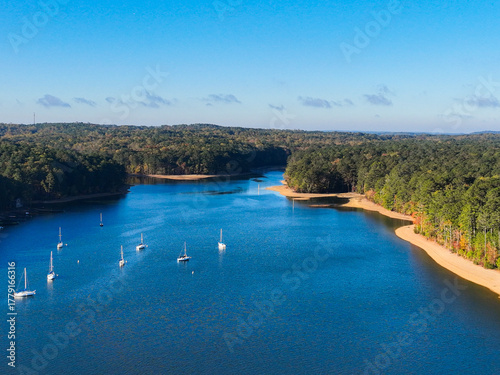 Sailboats on a blue lake on a sunny day