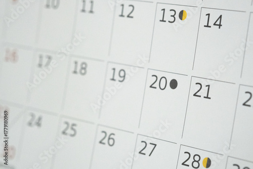 Close-up of a desk calendar showing days of the week.