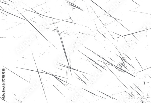 Abstract background of grey scratches and speckles on a white textured surface grunge