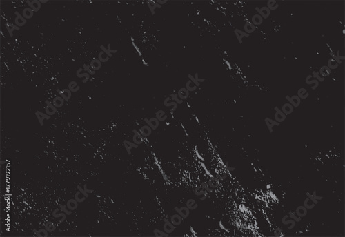 Dark grey textured background with scattered light grey speckles and streaks black