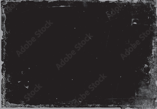 Dark textured background with distressed edges and scattered white speckles and scratches grunge black