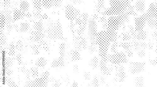 Abstract pattern of scattered gray dots of varying sizes on a white background creating a textured effect