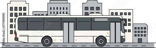A white and gray public bus driving on a city street with buildings in the background.