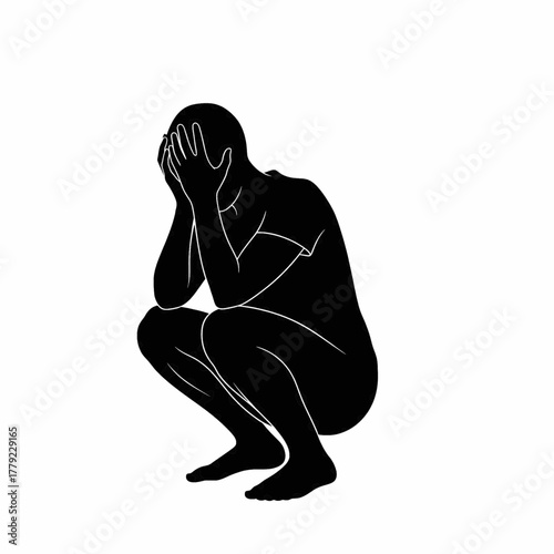 crouching person feeling sad