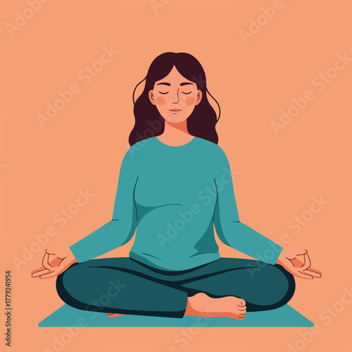 A woman in teal clothing meditates in the lotus position with eyes closed on a turquoise mat