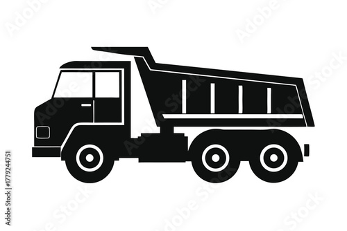 silhouette of a heavy duty dump truck for construction and hauling isolated on white background