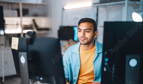 Indian programmer coding typing keyboard in modern office software developer programming IT technology career