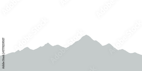 Snow-covered mountain range landscape with morning sun, clouds, and blue sky