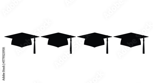 Four graduation caps in a row isolated on white background