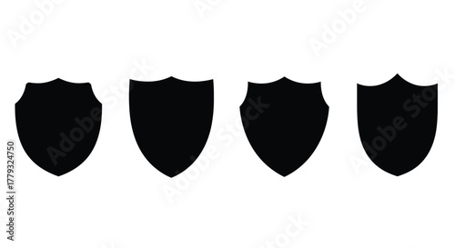 Four black shield icons isolated on white background in a row design
