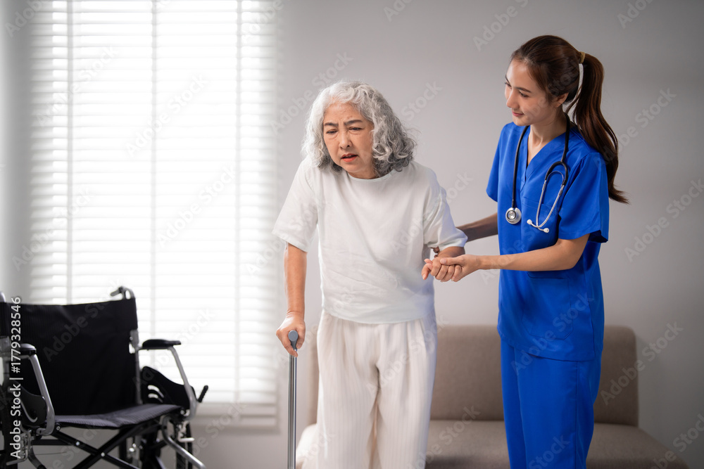Obraz premium Asian nurse caregiver assists older adult woman walks cane medical support rehabilitation therapy home healthcare senior living