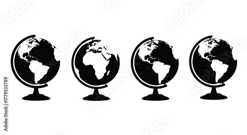 Four black globes are arranged in a row isolated on white background