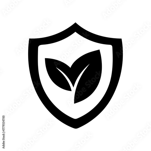Simple green concept shield with leaf silhouette vector illustration with white background for nature protection and environmental care concept 