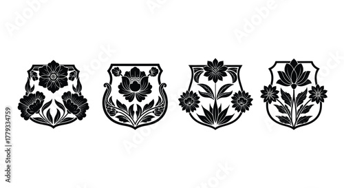 Four black floral shield icons isolated on white background, heraldic symbols