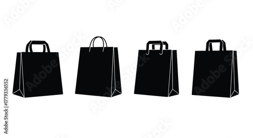 Four black shopping bags isolated on white background are displayed