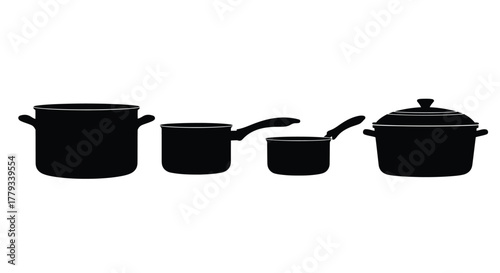 Four different pots and pans are arranged in a row isolated on white background