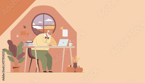 Elderly man remotely working on laptop in a cozy attic autumn setting