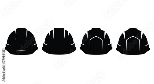Four construction helmets isolated on white background, symbolizing safety