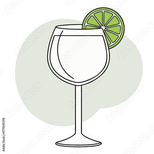 Cocktail glass with lime garnish