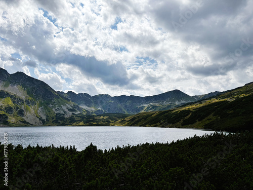 Fototapeta Naklejka Na Ścianę i Meble -  Scenic mountain lake in Zakopane Poland surrounded by rugged peaks and green slopes