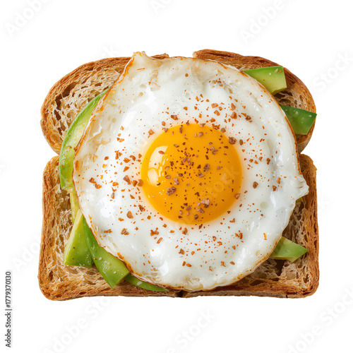 Delicious Fried Egg on Toast With Avocado Slices and Spices for a Healthy Bre...
