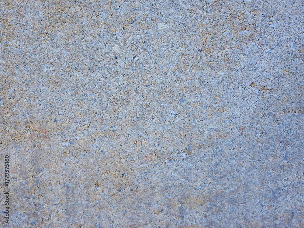 Fototapeta premium Close up cool concrete slab revealing fine grain and subtle staining across surface