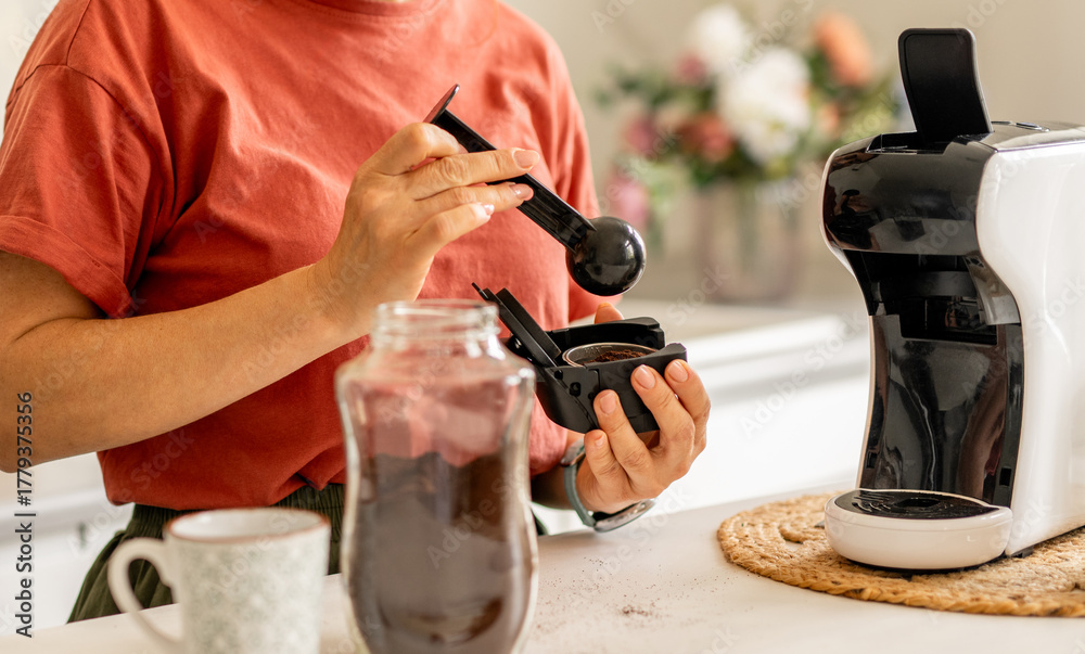 Fototapeta premium Woman Making Coffee In Coffee Machine
