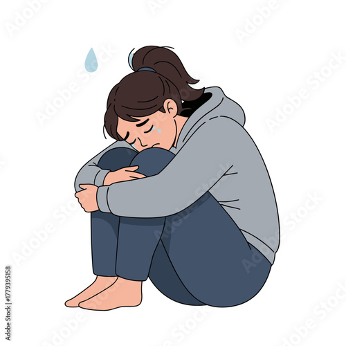 Sad Young Woman Huddled Inward Wearing Gray Hoodie and Blue Jeans on White Background With Tears Falling and Sweat Droplets Above