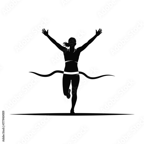 Runner from behind with arms raised crossing finish line