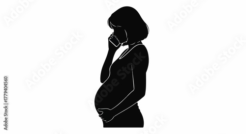 Silhouette of a pregnant woman talking on the phone with her hand on her belly