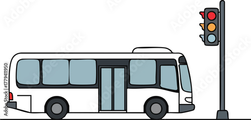 A white bus stopped at a traffic light on a city street with a traffic signal.