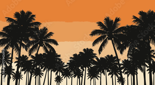 Tropical sunset silhouette of palm trees along an empty beach backdrop