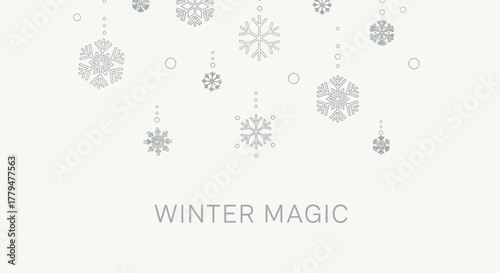 Elegant winter background with delicate snowflakes and the words winter magic below