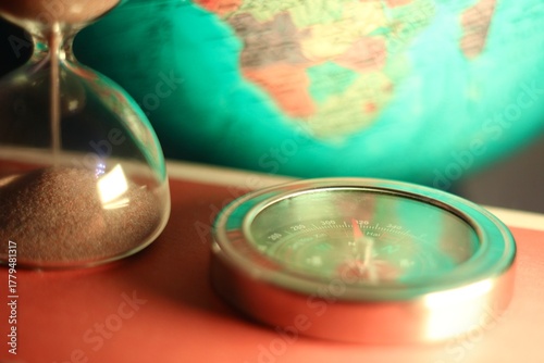 The hourglass and the compass and the globe symbols of time and travelling
