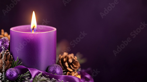 
Close-up of purple Advent candle with ribbon decoration.Space for text.