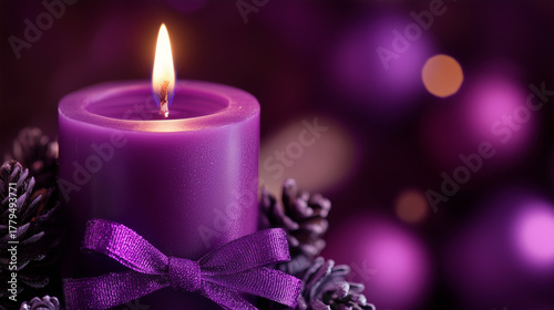 
Close-up of purple Advent candle with ribbon decoration.Copy space.