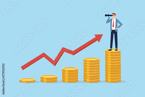 Businessman with binoculars standing on stack of coins looking at upward trending red arrow graph