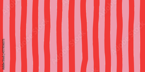 Hand drawn vertical stripes in bright red and soft pink for a playful and cheerful background pattern