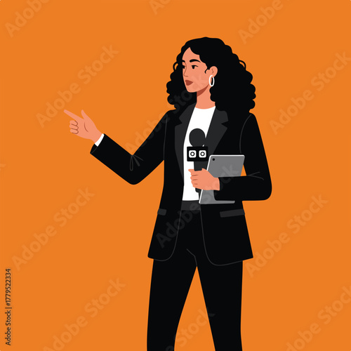 A female news reporter stands, pointing, holding a mic & tablet on orange bg. Wearing a suit & earrings