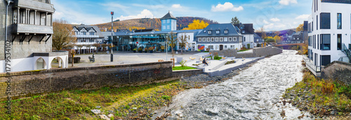 Photos Bad Berleburg marketplace with modern glass facade, half timbered houses, stream