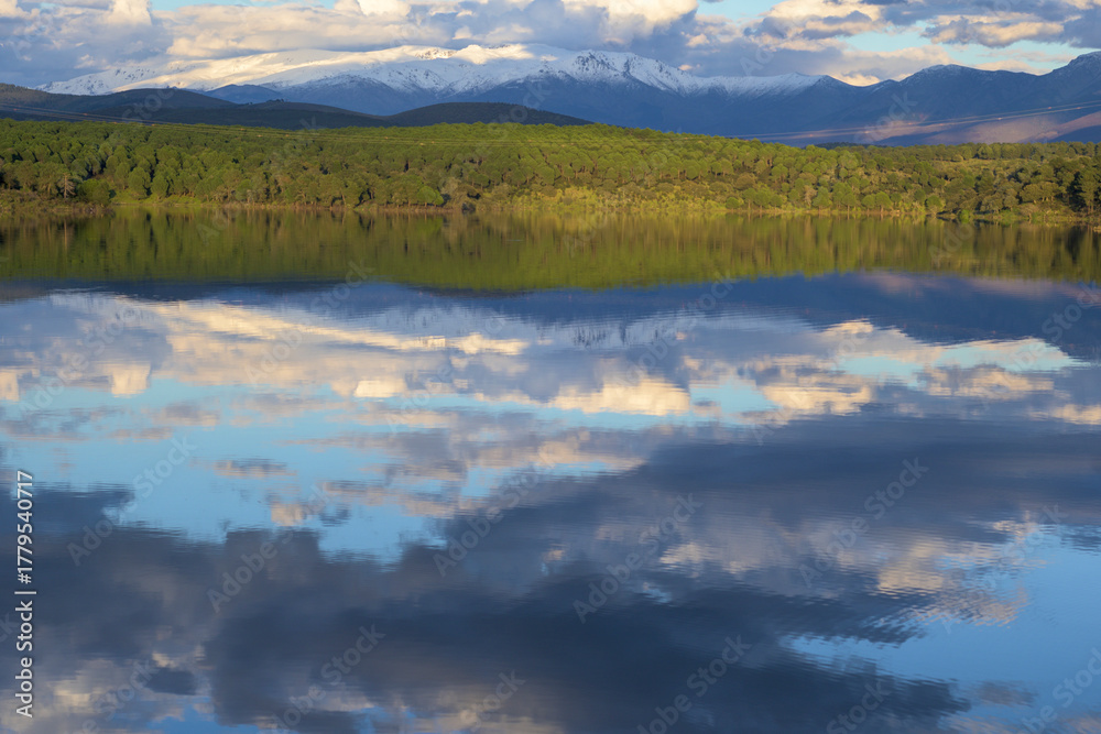 Fototapeta premium Lake Reflection of Snowy Mountains and Pine Forest