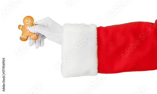Christmas Santa Claus hand holding or gives gingerbread man isolated on white background with clipping path. Design element.