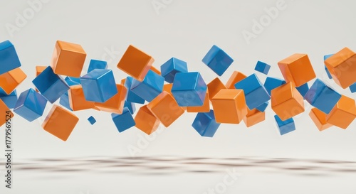 Numerous glossy blue and orange geometric shapes float horizontally above a subtly shaded surface