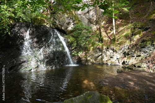 The waterfall at The Fairy Glen, Rosemarkie, Inverness, Scotland, in dappled sunlight. 