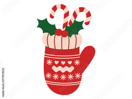 A red mitten filled with festive Christmas treats, including candy canes and holly.